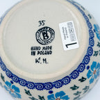 Bottom of Blue Cornflower deep bowl showing Ceramika Bona stamp and artist initials