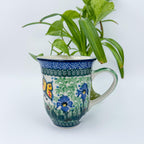 Spring Garden bistro mug on white background, straight-on view showing butterfly