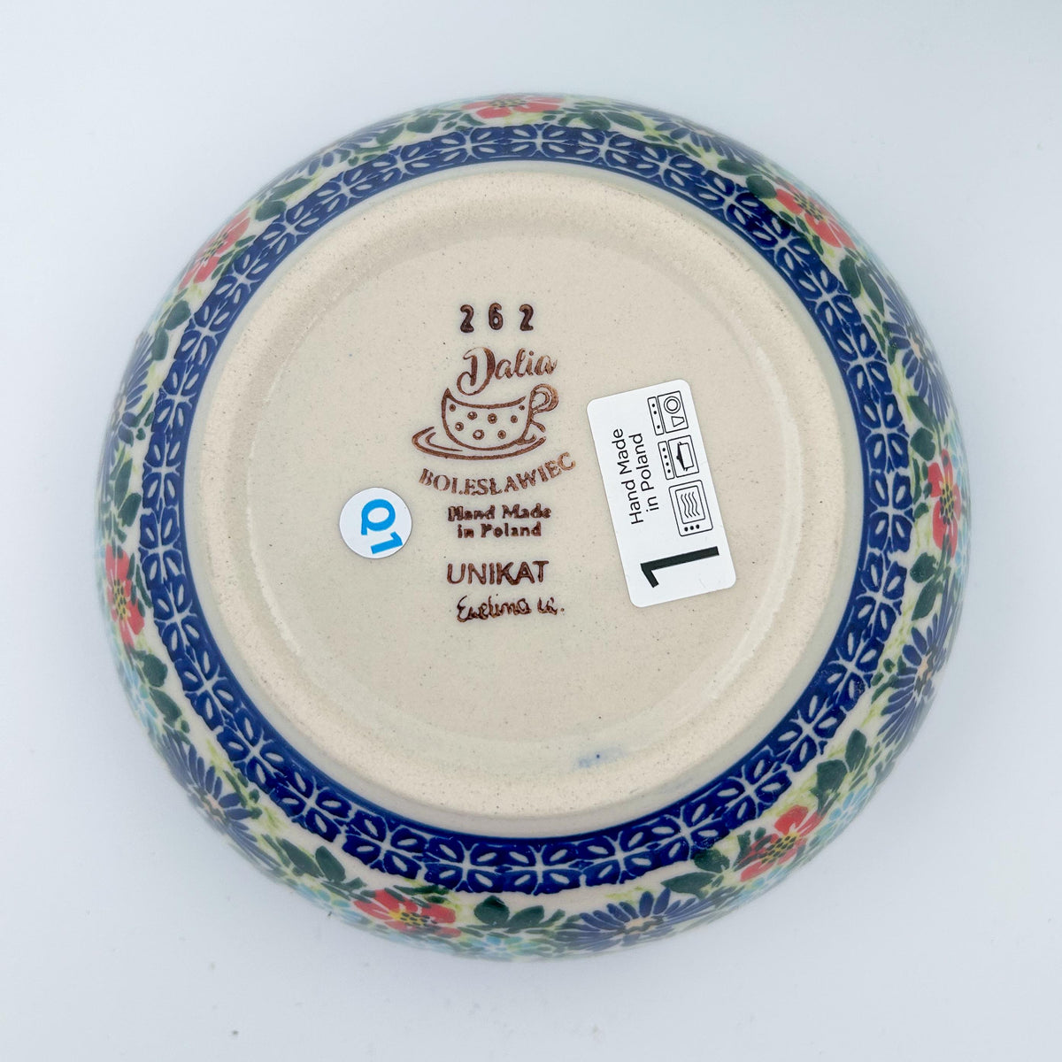 Bottom of Butterfly Flower Bed deep bowl showing Dalia Unikat stamp and artist signature