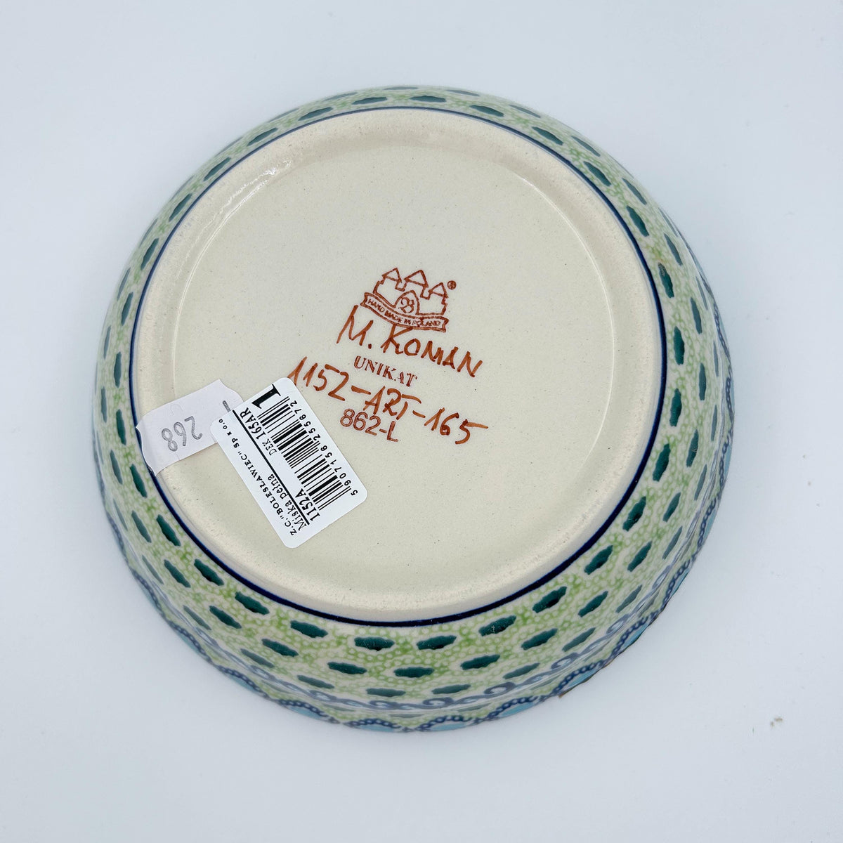 Bottom of Evangeline bowl showing Unikat stamp and artist signature M. Roman