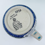 Bottom of Forget Me Not bistro mug showing Unikat stamp and artist signature