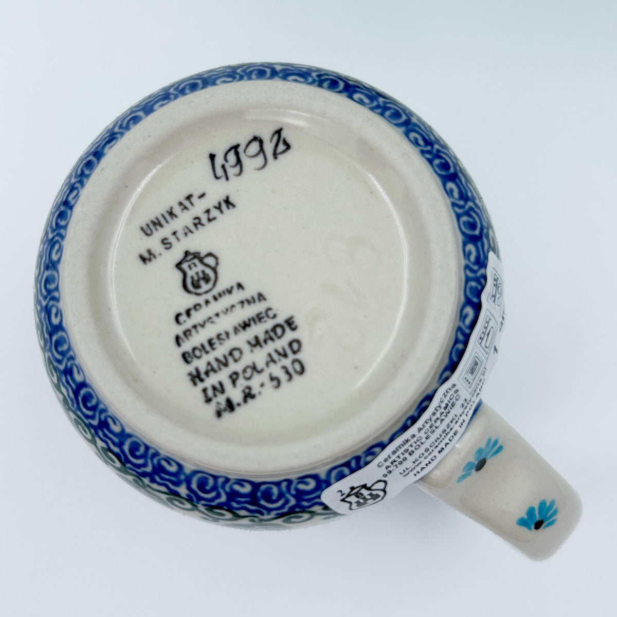 Bottom of Forget Me Not bistro mug showing Unikat stamp and artist signature