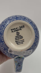 12 oz Polish Pottery floral bubble mug is made by talented artisans from Poland.  holds 12 ounces of fluid.