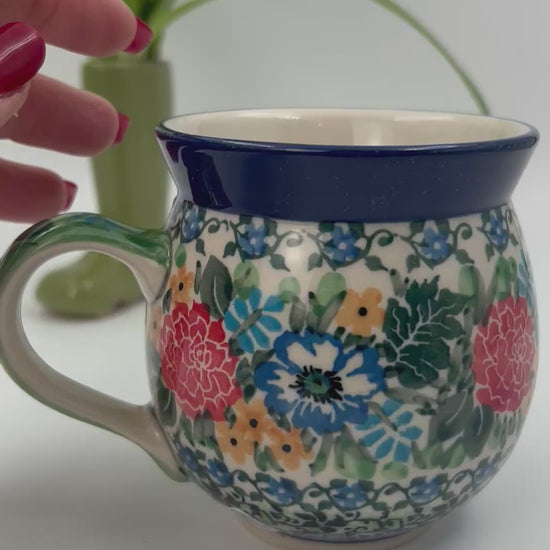 12 oz Polish Pottery floral UNIKAT bubble mug is made by talented artisans from Poland. 
Dimensions 5" x 3.66" x 3.78"
Ceramika Artystyczna Company